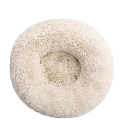 Light brown fluffy pet bed on a white background